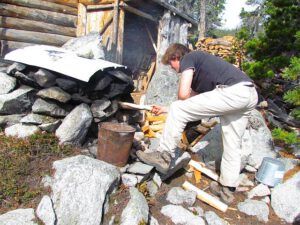 stoking oven (Baking Bread at Nuk Tessli)