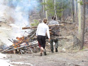 sam and wolf burning (Having fun on the road at Ginty Creek.)