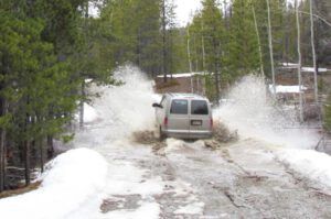 van going through puddle (Having fun on the road at Ginty Creek.)