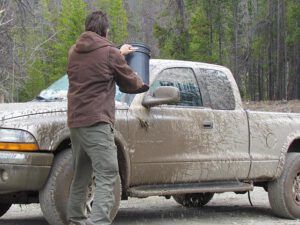 tossing water onto mud. (The boghole)