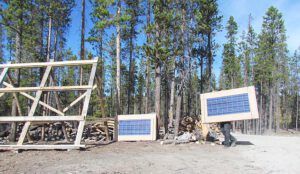 unloading panels (Work is stumbling along at Ginty Creek)