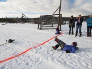 5 tossing saw 3 (Tatla Lake Winter Fun Party)