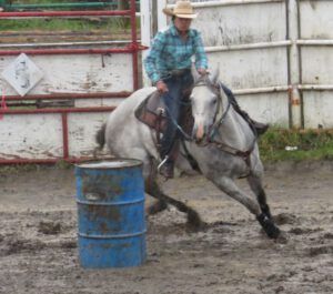 16 barrel racing mud bath (79th Stampede, Anahim Lake)