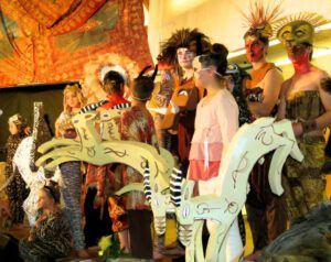 cast makeup gazelles in front (The Lion King)